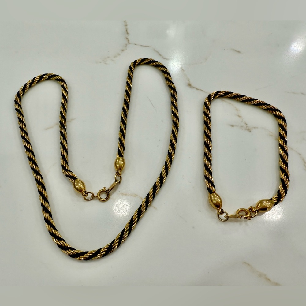 Gold and black metal necklace and bracelet set